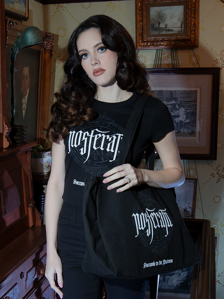 Practical yet steeped in mysticism, the Count Orlock Sigil Tote Bag in Black is your everyday gothic ally. Its sigil print weaves a spell of shadowy elegance.