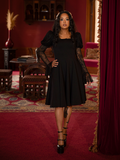 Like a shadow-born queen, the wearer commands the night in this sweeping gothic masterpiece.