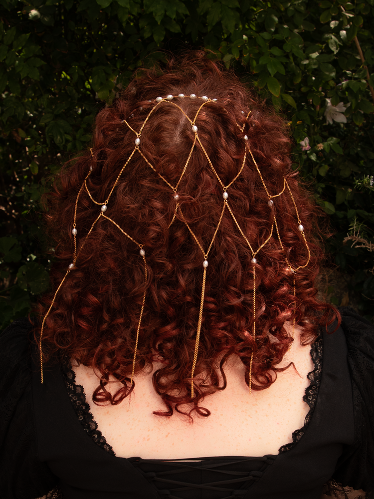 A romantic relic reborn—this gold tassel chain hair net with pearls drapes beautifully, blending vintage luxury with gothic grace. Durable yet delicate; store dry to protect its luster.
