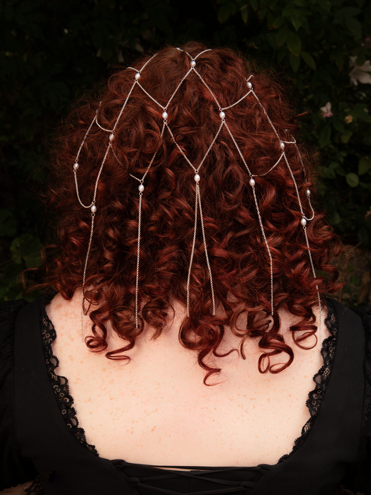 A vision of antique romance—silver tassel chains entwined with luminous pearls create a veil of gothic opulence. Comfortable to wear, gentle on hair; avoid moisture for lasting shine.