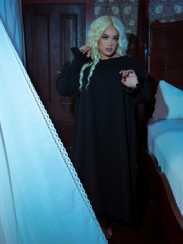 Capturing a moody, ethereal aesthetic, a female model looks utterly spellbinding in the Whimsigoth-inspired Victorian Sleeping Dress in Black.