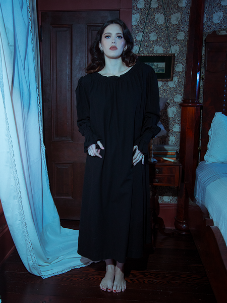 Delicate yet bold, this black Victorian sleeping dress features cascading satin folds and a cinched waist, perfect for gothic dreamers.