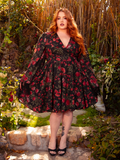 The Styx Wrap Dress with Fringe in Pomegranate Print is a hauntingly romantic creation. Its deep red hues and flowing silhouette evoke the allure of gothic poetry and forbidden love, perfect for moonlit dances.