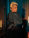 Gothically stunning female models captivate as they pose in the Taffeta Edwardian Blouse in Black, displaying its allure through various stances.