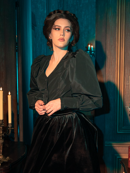 Embodying gothic allure, female models showcase the Taffeta Edwardian Blouse in Black, striking diverse poses.