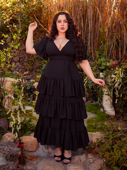 The Underworld Dress in Black is a masterpiece of gothic sophistication. Its rich, flowing fabric cloaks you in the essence of dark romance, ideal for candlelit dinners or shadowy garden strolls. Each movement in this dress is a waltz with the night.