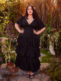 Surrender to the enchantment of the Underworld Dress in Black. With its luxurious black fabric, this dress wraps you in a cascade of gothic allure. Perfect for evening affairs or secret rendezvous, it whispers tales of timeless beauty and intrigue.