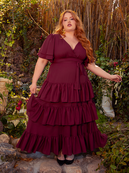 Surrender to the enchantment of the Underworld Dress in Wine Red. This dress, with its luxurious wine-red fabric, wraps you in a cascade of gothic sophistication. Perfect for evening affairs or secret rendezvous, it whispers tales of timeless beauty and mystery.