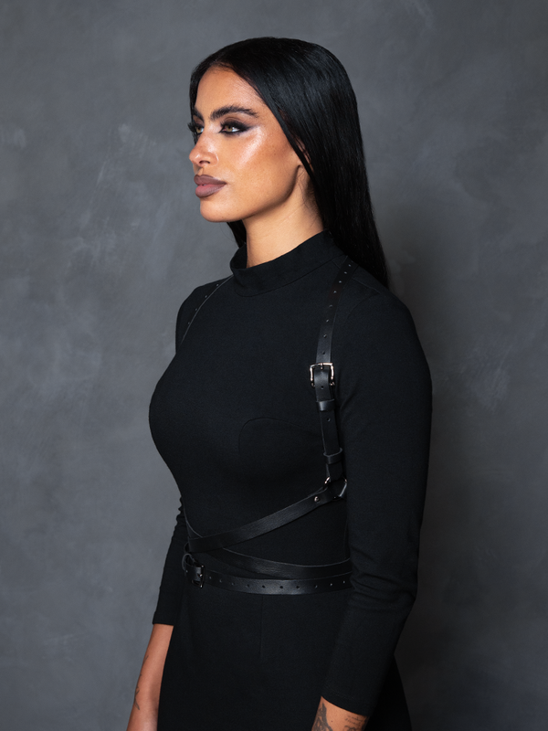 Female model styled in dramatic noir aesthetics wearing the Diana Silver Gothic Harness for a timeless vintage goth look.