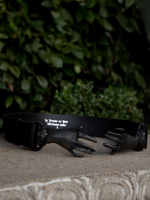 Secure your style with the romantic, gothic allure of the Victorian Hands Belt in a deep matte black.