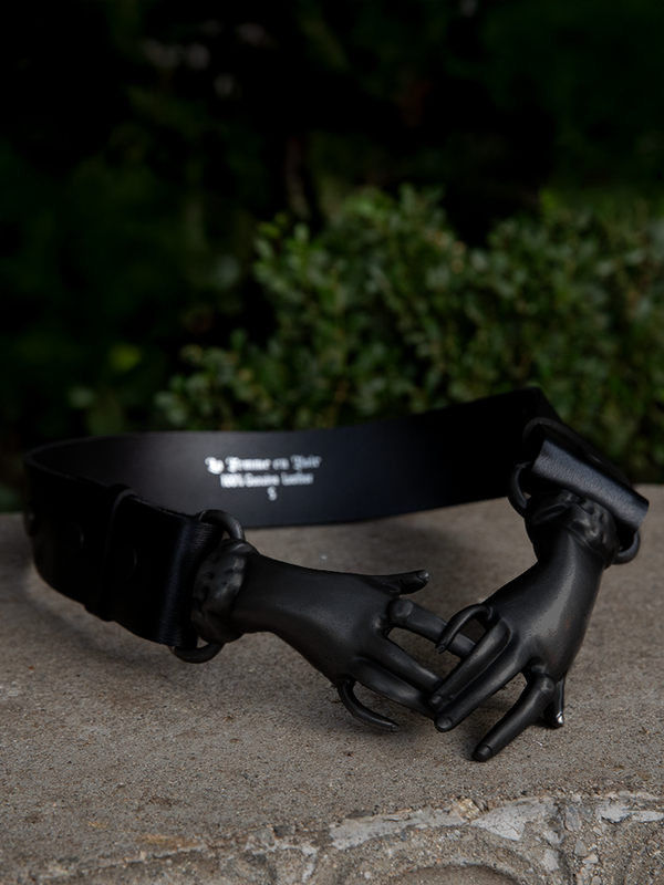 The Victorian Hands Belt in Black is a staple piece for lovers of dark glamour and Victorian-era motifs.