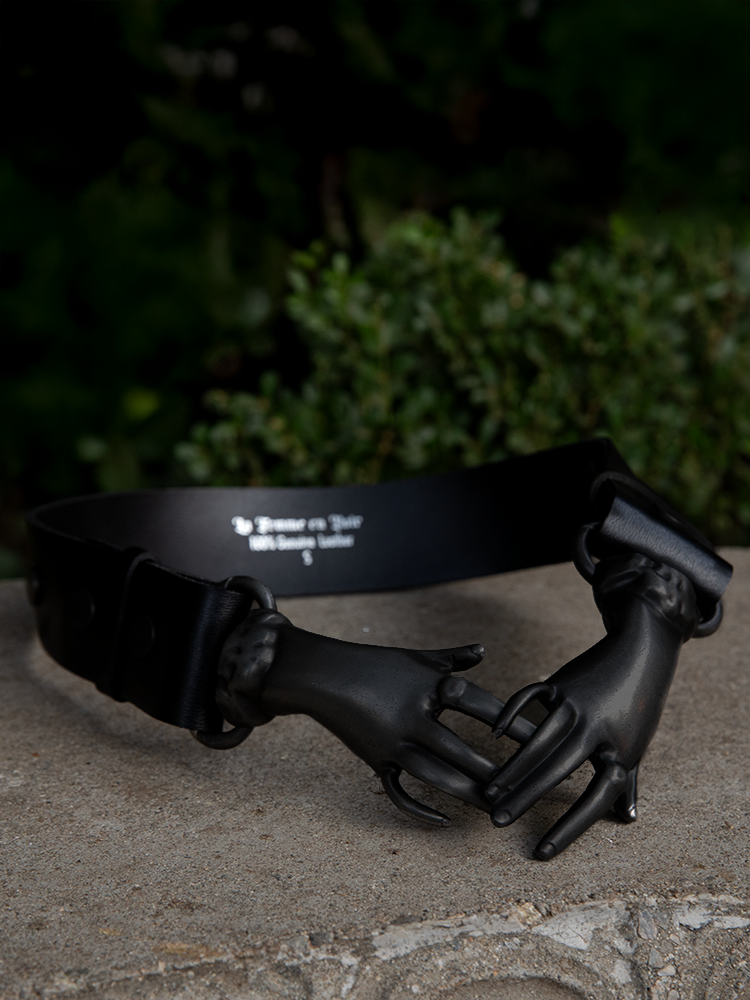 The Victorian Hands Belt in Black is a staple piece for lovers of dark glamour and Victorian-era motifs.