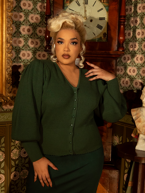 Soft, warm, and exquisitely detailed, this Victorian knit cardigan boasts intricate cable-knit patterns, puffed shoulders, and a fitted waist for a touch of vintage romance.

