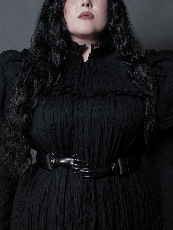 A hauntingly beautiful waist accessory, the Victorian Hands Belt in Black defines the essence of dark glamour.