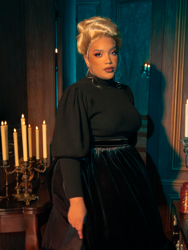 Gothically glamorous female models exude sophistication while modeling the Victorian Cycling Pullover Sweater in Black, displaying its versatility through poses.