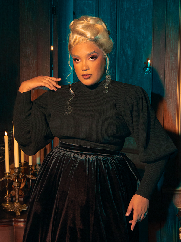 Featuring gothically gorgeous female models, the Victorian Cycling Pullover Sweater in Black is showcased through an array of poses.