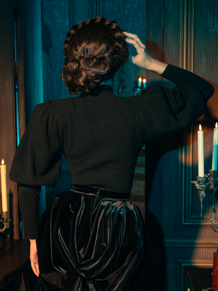 The Victorian Cycling Pullover Sweater in Black is elegantly modeled by gothically gorgeous female models, portraying its allure through various poses.