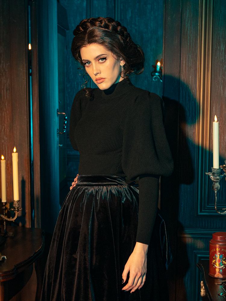 Gothically stunning female models showcase the Victorian Cycling Pullover Sweater in Black, striking a range of captivating poses.