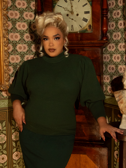 Ride in style with this Victorian-inspired pullover, crafted in a deep hunter green knit. Its puffed sleeves and tailored fit evoke vintage sophistication.

