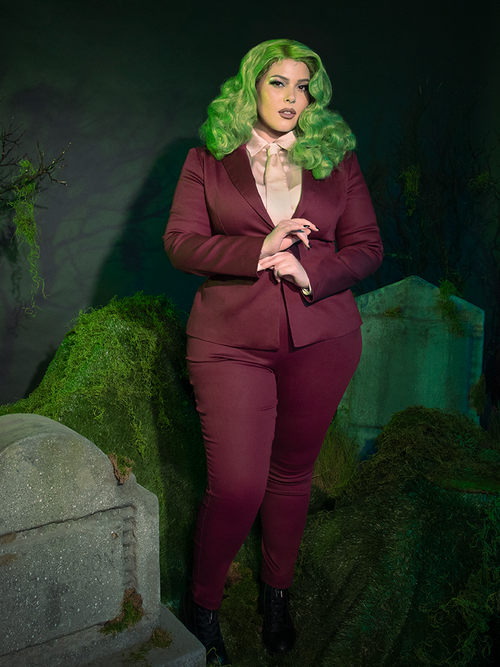 Command the night with the Beetlejuice™ Wedding Pants in Burgundy. These tailored, high-waisted trousers bring a bold, gothic twist to formalwear, their rich velvet fabric offering an opulent feel perfect for shadowy ceremonies or elegantly dark affairs.