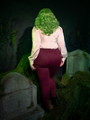 For those who embrace the unconventional, the Beetlejuice™ Wedding Pants in Burgundy bring gothic glamour to formalwear. Crafted in plush velvet, these pants move with a haunting grace, perfect for weaving your own dark fairytale in every step.