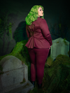 Tailored for dark romantics, the Beetlejuice™ Wedding Pants in Burgundy are a statement of gothic sophistication. The deep hue and sleek fit offer a dramatic yet refined silhouette, ideal for those who walk the line between luxury and rebellion.