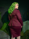 The Vamp Suiting Skirt in Burgundy is your perfect partner for nocturnal adventures. This tailored piece exudes gothic elegance with its rich burgundy hue, striking the balance between polished refinement and darkly enchanting allure.