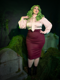 With its sleek, high-waisted design, the Vamp Suiting Skirt in Burgundy radiates dark sophistication. The lush, wine-toned fabric adds a gothic richness, perfect for pairing with lace or velvet for a look that blends power and mystique.