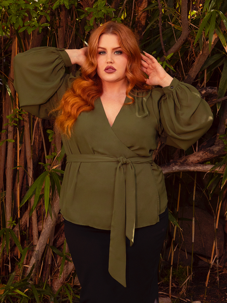 Embrace the allure of dusk with the Georgette Wrap Top in Olive. Its lightweight georgette fabric cascades gracefully, offering a perfect blend of comfort and gothic sophistication. Perfect for candlelit dinners or shadowy garden strolls, it transforms the ordinary into the extraordinary.