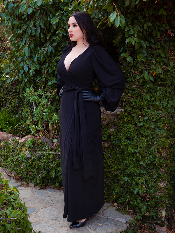 Female model wearing the Black Widow Wrap Gown in Solid Black, showcasing dark romantic style and timeless vampiric beauty.
