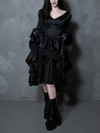 A breathtaking display of modern gothic clothing, a female model radiates dark romance in a midnight black satin gown.
