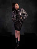 Posing in the  Alien™ Xenomorph Bomber Jacket, Micheline Pitt wears an edgy gothic style outfit.