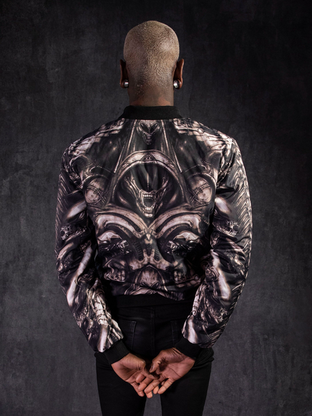 Braxton Holmes facing away from the camera to show off the design of the  Alien™ Xenomorph Bomber Jacket.