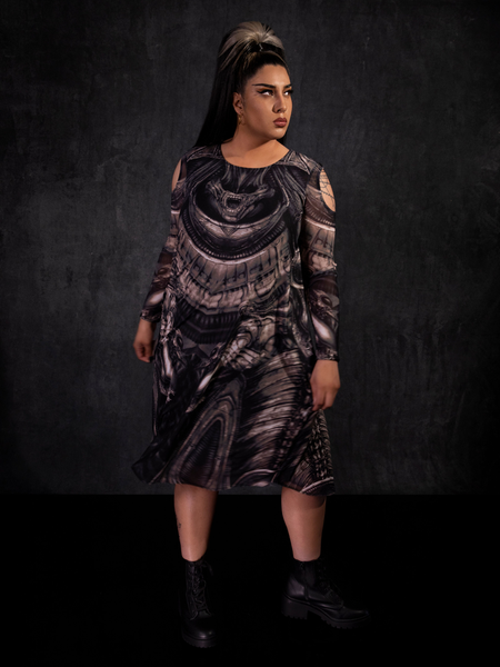 Jyoti Kaur posing with a determined look on her face while wearing the Alien™ Xenomorph Trapeze Dress.