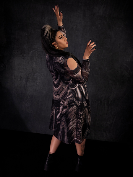 Jyoti Kaur posing in the Alien™ Xenomorph Trapeze Dress from gothic clothing brand La Femme en Noir.