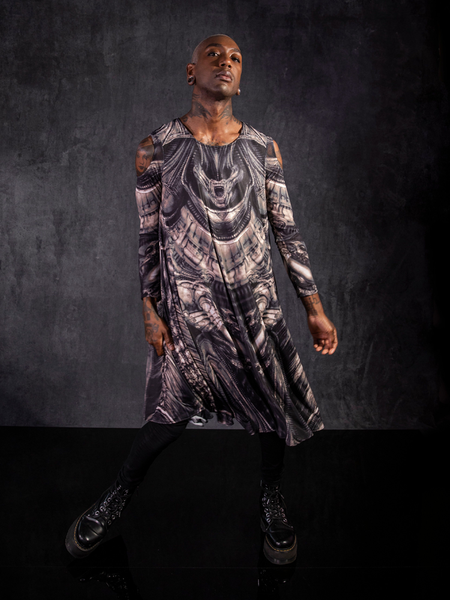 Braxton Holmes swaying in the gothic inspired Alien™ Xenomorph Trapeze Dress from La Femme en Noir.