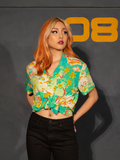 Female model posing with her hands in the back pockets of her jeans and showing off the ALIEN Space Souvenir Button Up Shirt tied in the front.