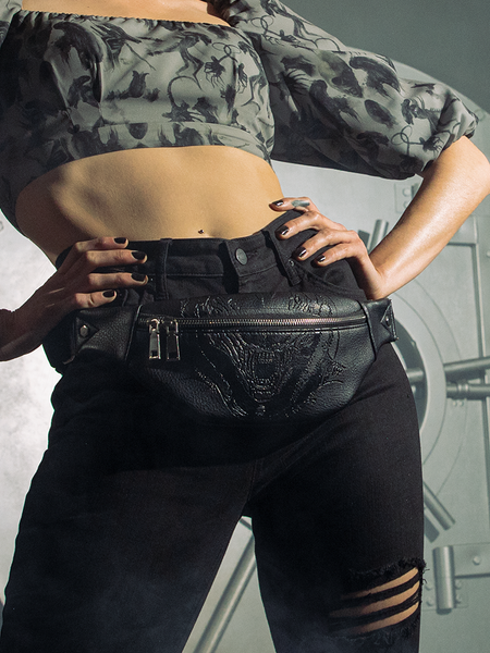 The ALIEN Xenomorph Hip Bag being worn around a female model's waist. 