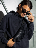 Male model wearing the ALIEN Xenomorph Hip Bag around their shoulder.