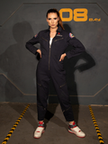 The ALIEN Ripley Flight Suit in Navy being modeled by tall brunette model with her hair pulled back into a ponytail.