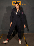 KJ standing and looking into the camera with one leg outstretched while modeling the ALIEN Ripley Flight Suit in Navy from La Femme en Noir. 