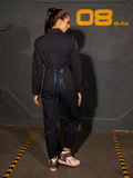 The back of the ALIEN Ripley Flight Suit in Navy featuring intricate tie.