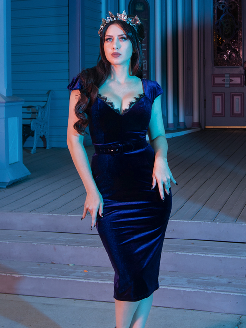 Ashley Thomson looks up towards the sky while posing in the Baudelaire Wiggle Dress in Midnight Blue from goth glamour clothing company La Femme en Noir.