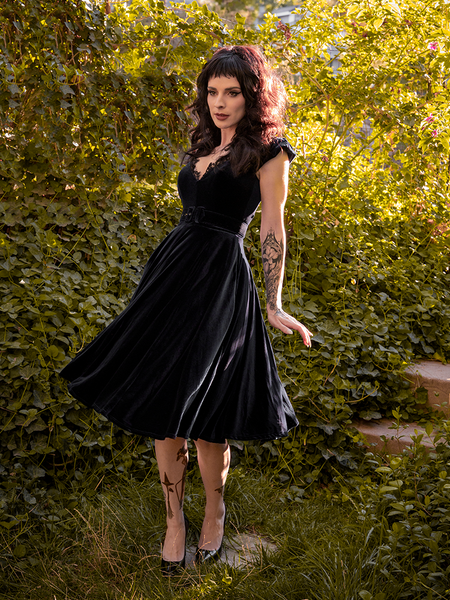 Stephanie twirling in the Baudelaire Swing Dress in Black from La Femme en Noir.