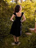 The back of the Baudelaire Swing Dress in Black from goth glamour clothing company La Femme en Noir.