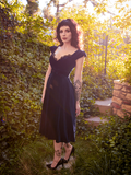 The goth inspired Baudelaire Swing Dress in Midnight Blue from gothic clothing company La Femme en Noir.