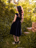 The back of the Baudelaire Swing Dress in Midnight Blue from gothic glamour clothing company La Femme en Noir.