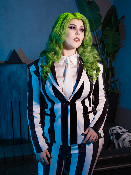 Green haired model wearing a Beetlejuice outfit highlighted by the Bowie Blouse w/Matching Tie in White Charmeuse.