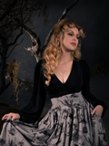 Linda in the Bishop Blouse in Black photographed in a grey Sleepy Hollow skirt.