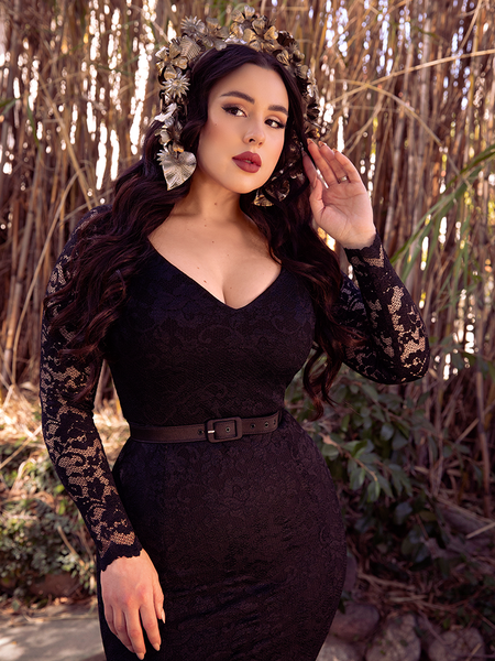 Rachel Sedory wearing the Black Marilyn Lace Gown in Black in a bamboo garden.